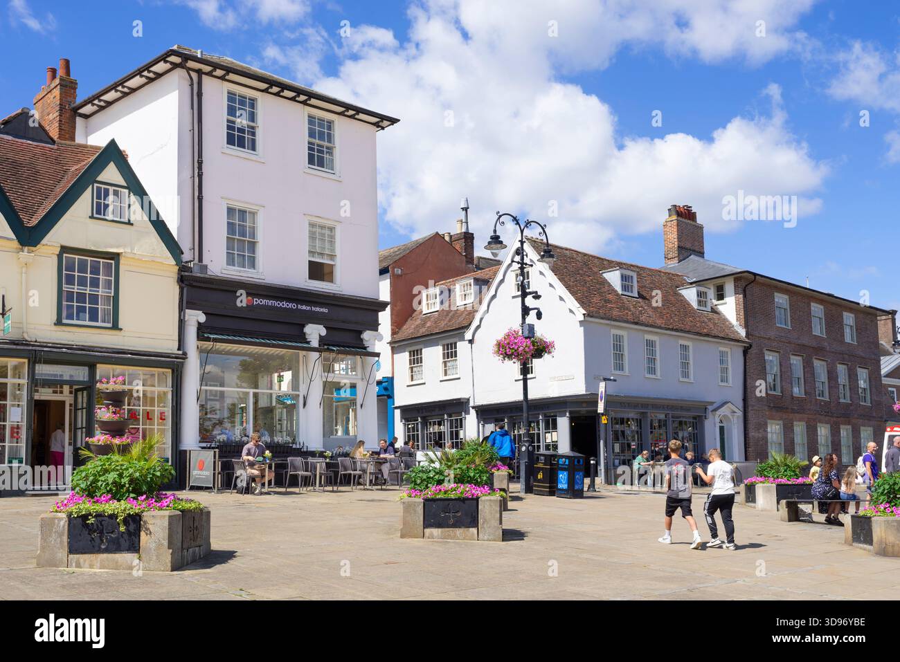 Bury St Edmunds Shops and Restaurants  with people on Abbeygate street and Angel Hill Bury St Edmunds Suffolk England UK GB Europe Stock Photo