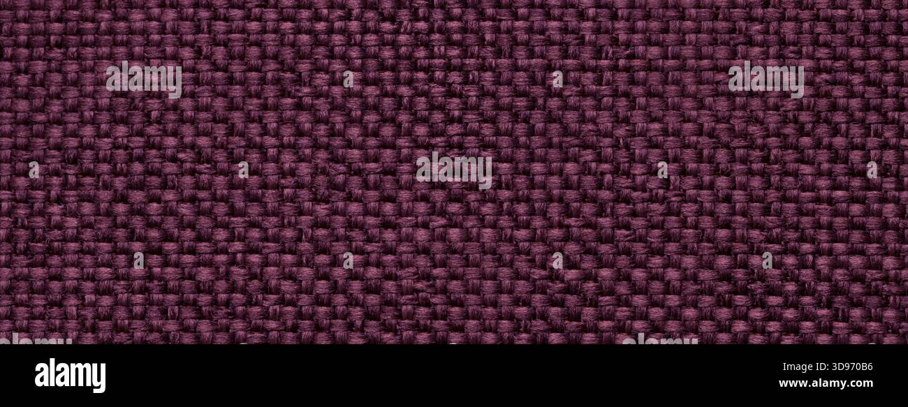 Dark purple woven textile macro texture background. Knitted wine fabric pattern for material design and backdrop. Stock Photo
