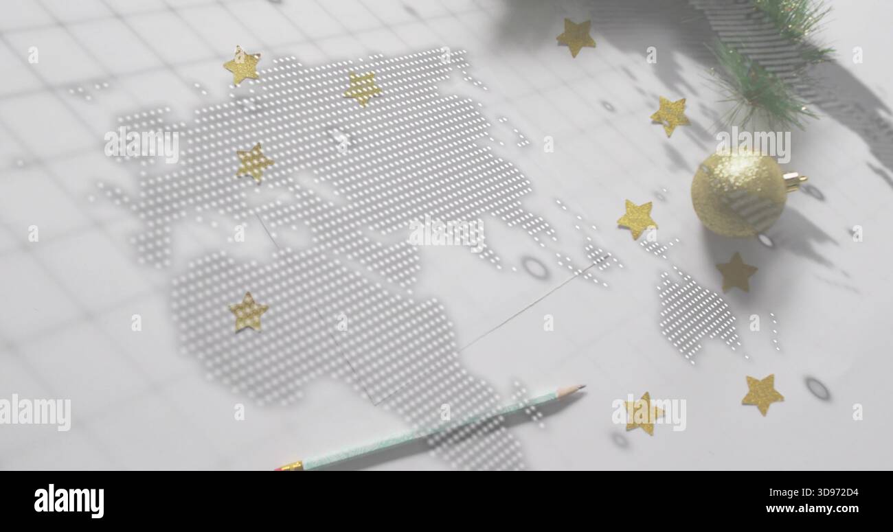 Displaying dotted world map of perforations on white grid paper desk, with gold ornament and pencil Stock Photo