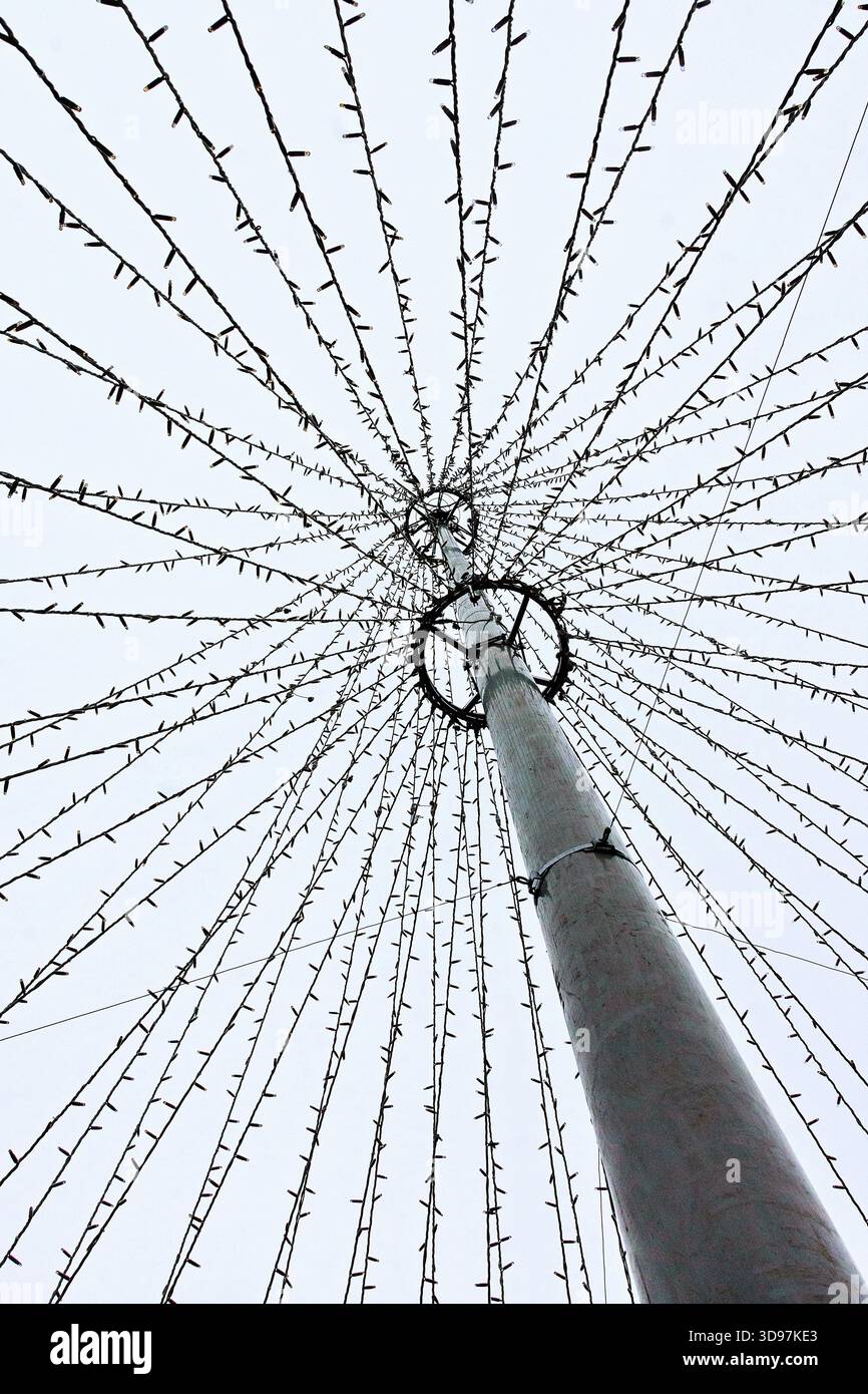 Silhouette of modern-stymle Christmas tree with fairy lights - Tours, Indre-et-Loire (37), France. Stock Photo