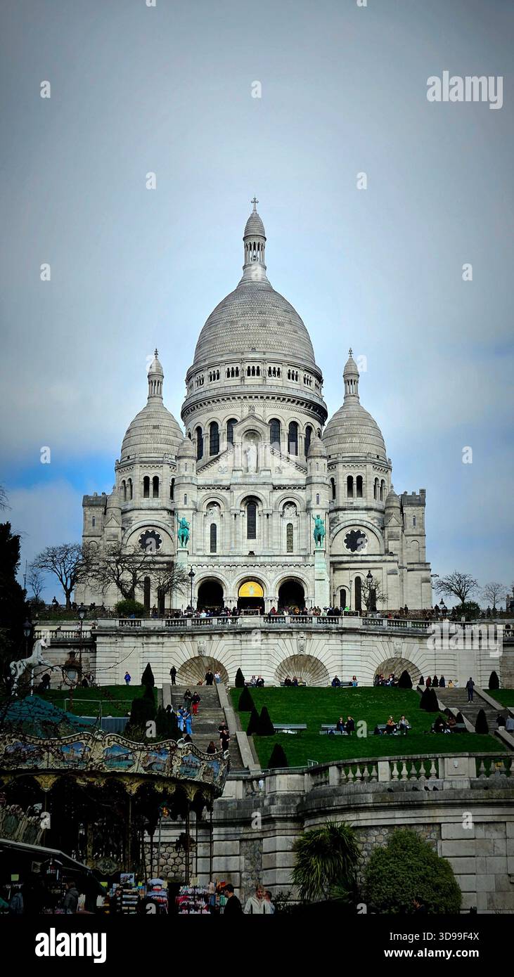 Sacré-Cœur Basilica in Paris, France, with white domes and terraced gardens on Montmartre hill. - Smartphone Captured Stock Image