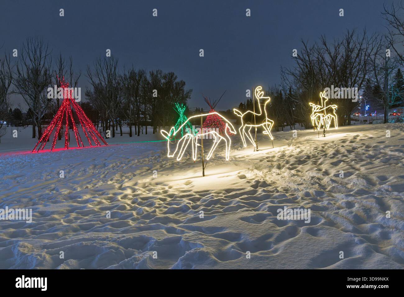Outdoor Christmas lights showcasing a nat9ve village and teepees at the Festival of Lights, Confederation Park, Calgary Alberta Canada Stock Photo