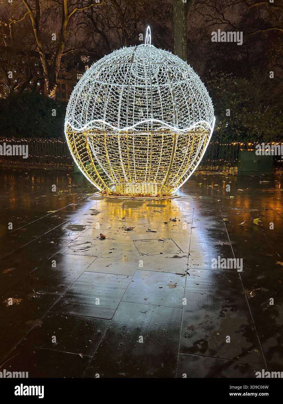 Giant illuminated Christmas bauble decoration on Portman Square in London, UK - Smartphone Captured Stock Image
