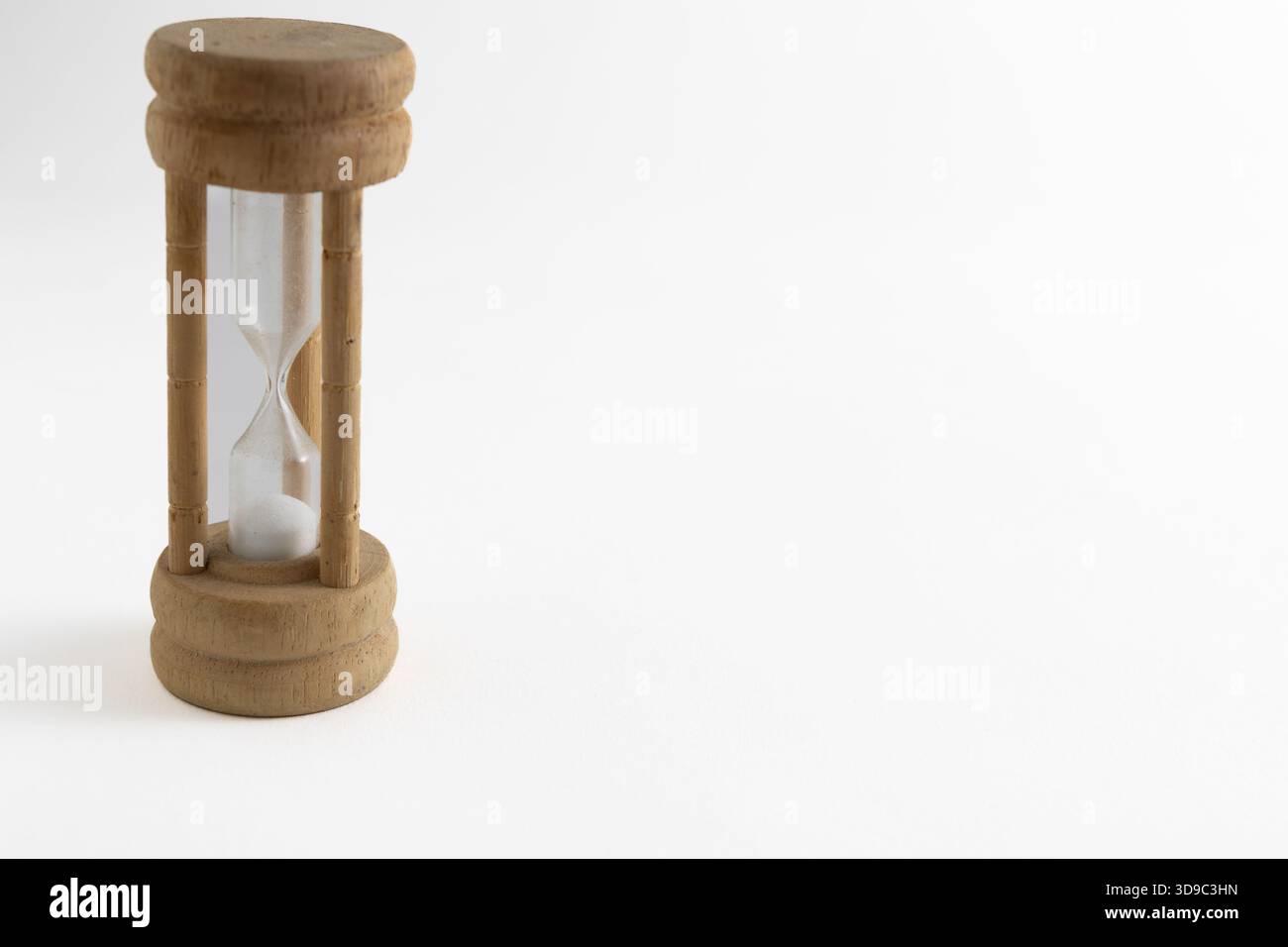 Wooden hourglass egg timer on a white background Stock Photo