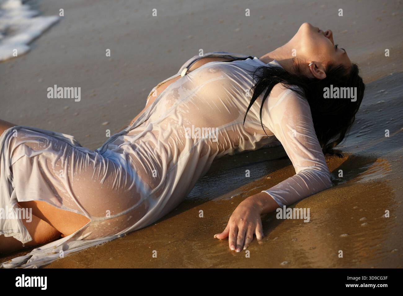 The girl in a wet dress at coast of the sea. Gold sand. Bulgaria Stock Photo - Alamy The girl in a wet dress at coast of the sea. Gold sand. Bulgaria Stock Photo - Alamy