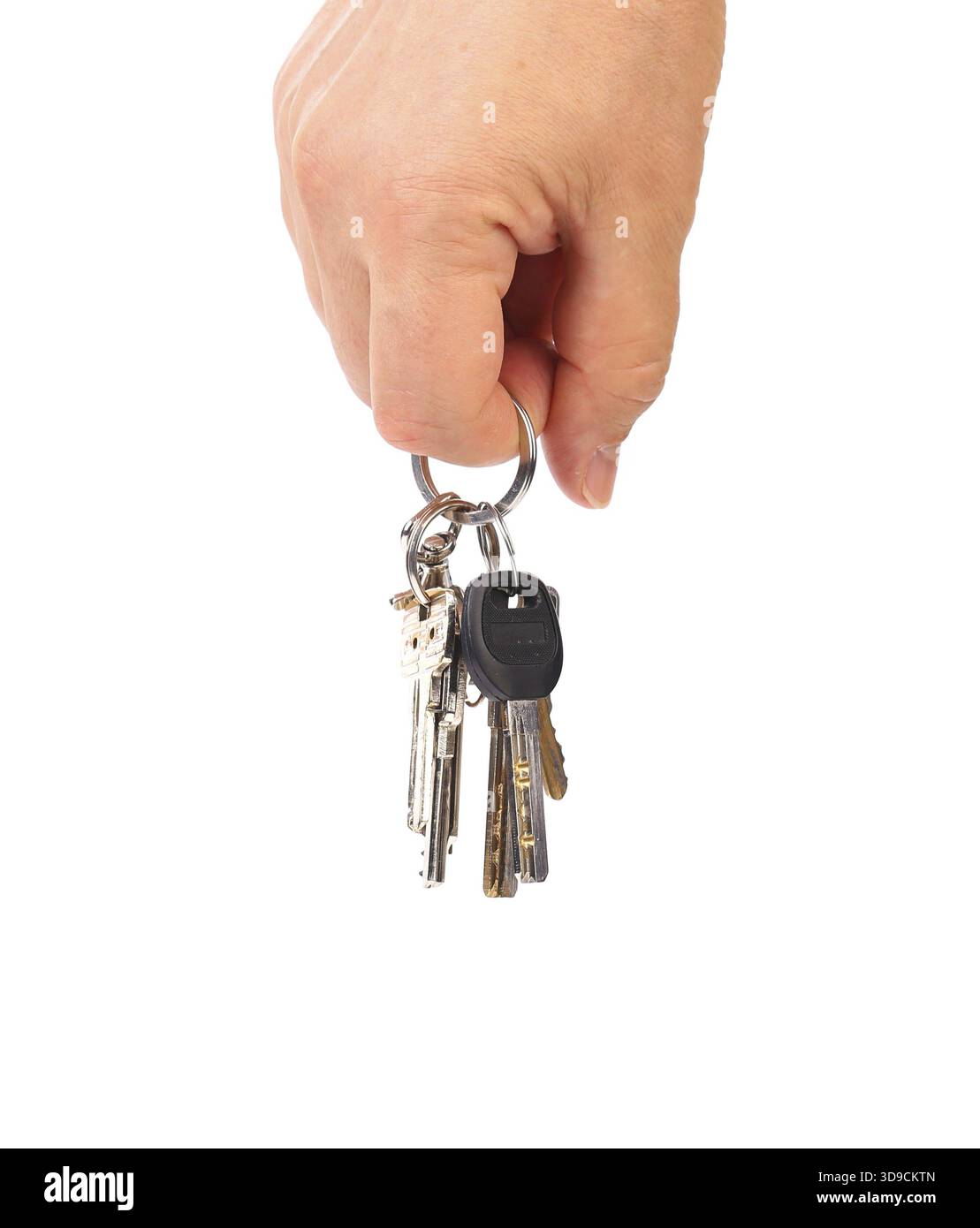 Hand with several keys. Isolated on white background Stock Photo