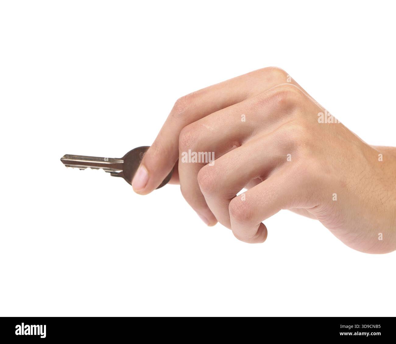 Hand holds a small key. Isolated on a white background Stock Photo