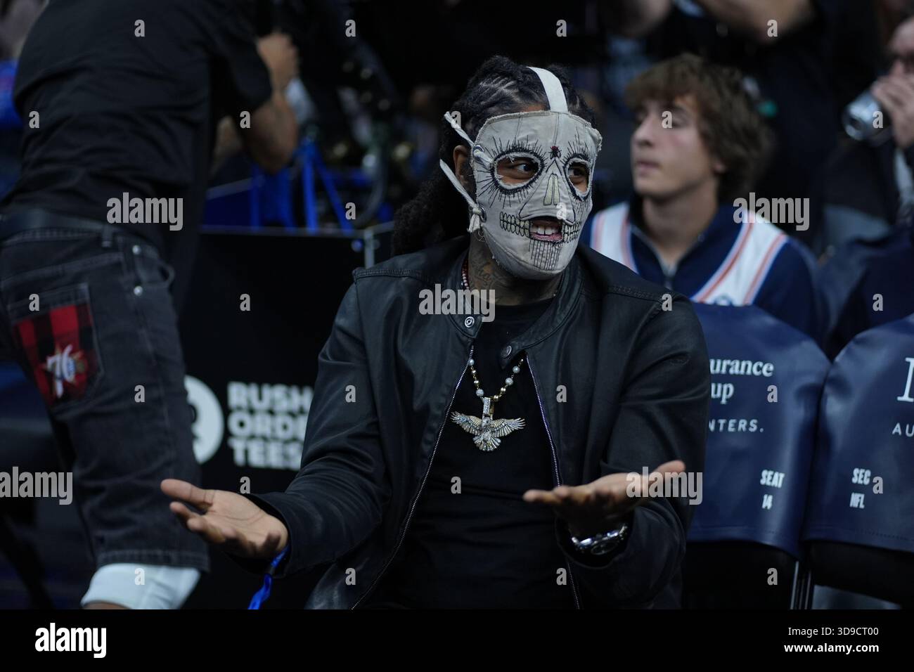 Rapper Skrilla reacts during an NBA basketball game Thursday, Dec. 4 ...