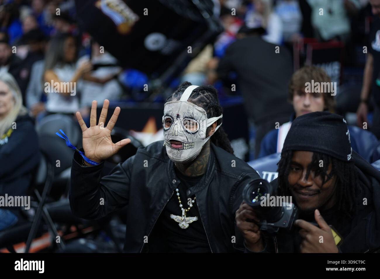 Rapper Skrilla reacts during an NBA basketball game Thursday, Dec. 4 ...