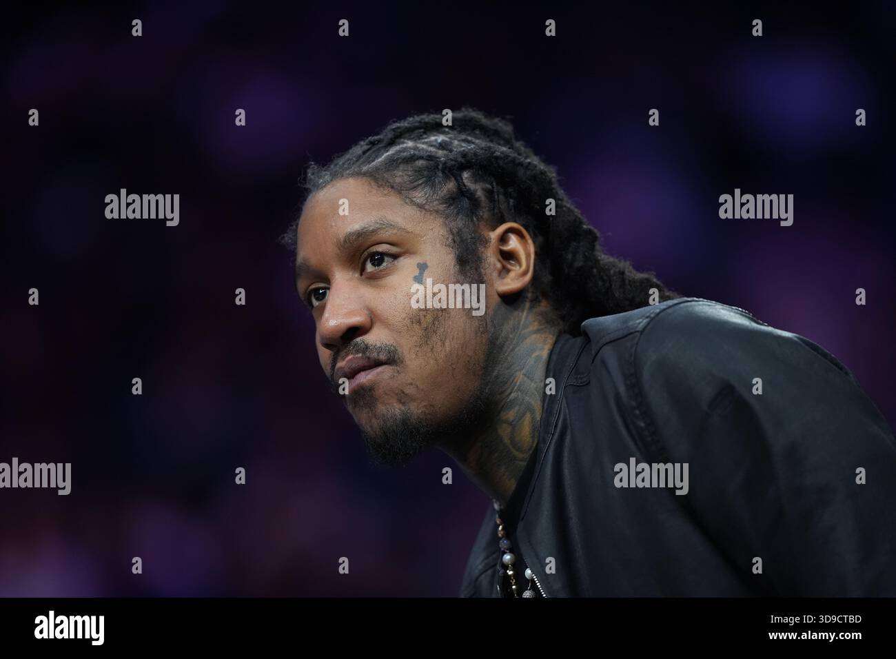 Rapper Skrilla reacts during an NBA basketball game Thursday, Dec. 4 ...