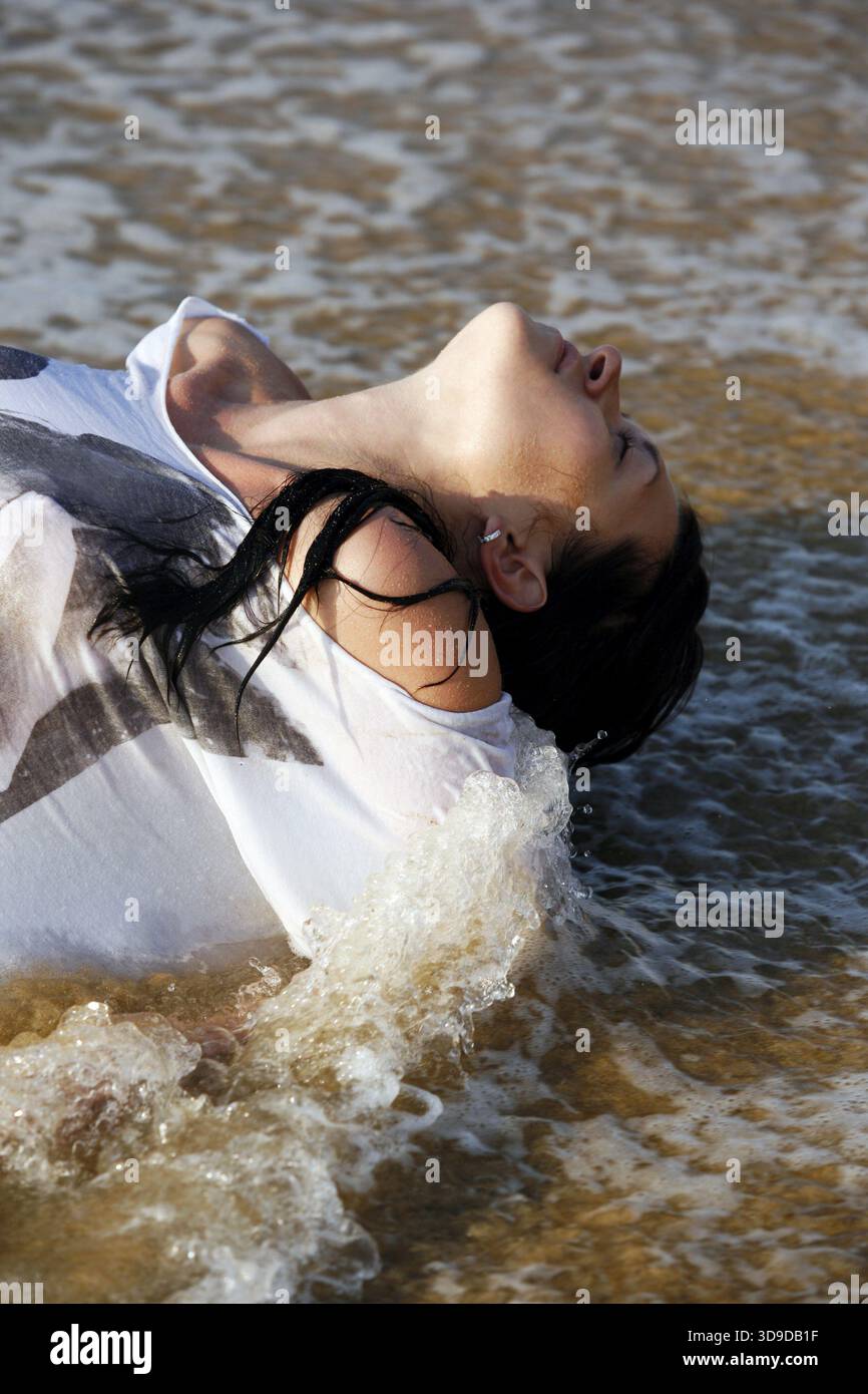 Girl in wet dress coast hi-res stock photography and images - Alamy