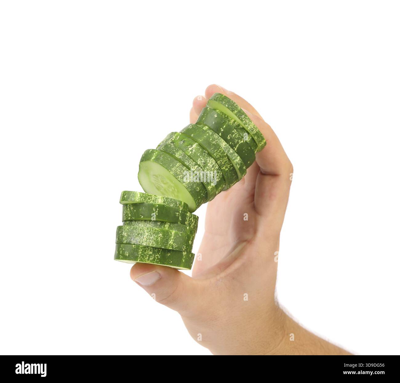 Hand holds stack juicy cucumber on a white background Stock Photo