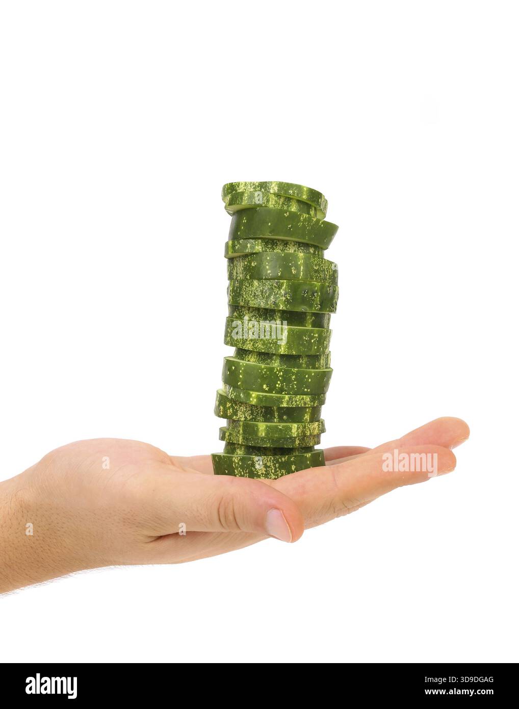 Hand holds stack juicy cucumber on a white background Stock Photo