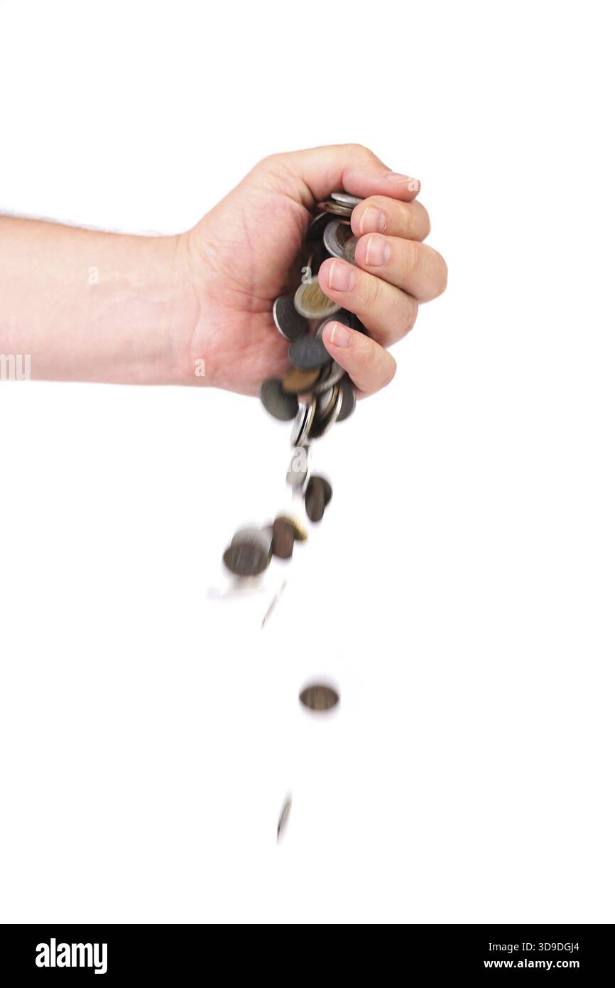 Coins spilling out of hand. Hand giving. Isolated on a white background ...