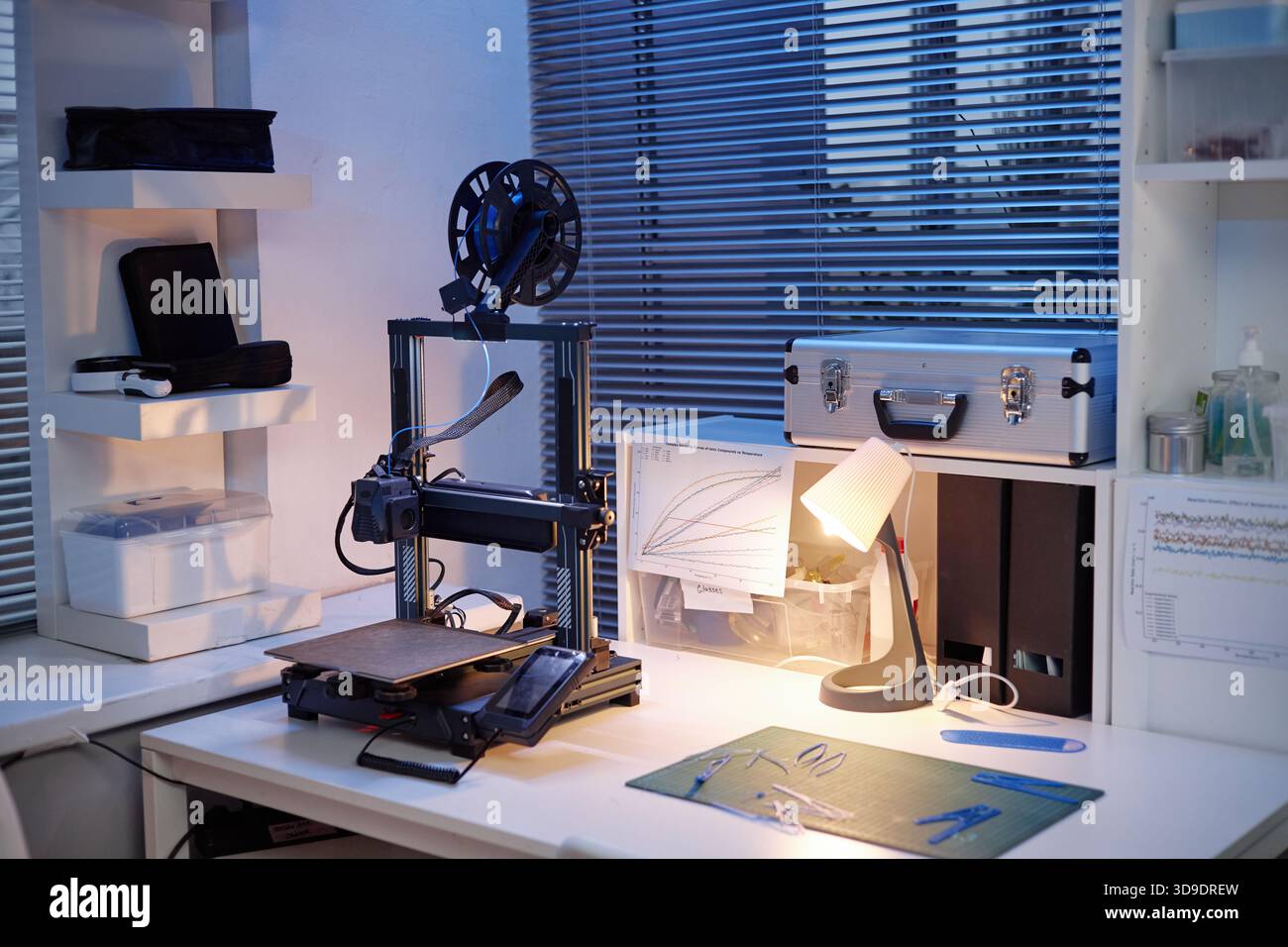 Modern 3d Printer Operating on Desk in Contemporary Engineering Workspace Stock Photo