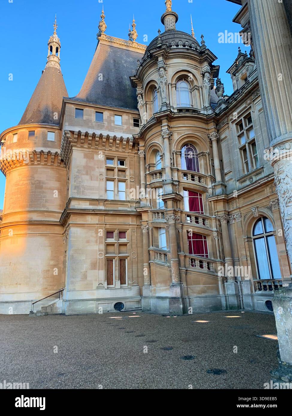 Neo-Renaissance French Chateau- inspired Waddeston Manor house Ornate facade Turrets and domes Steep slate roof decorative stone work Symmetrical - Smartphone Captured Stock Image