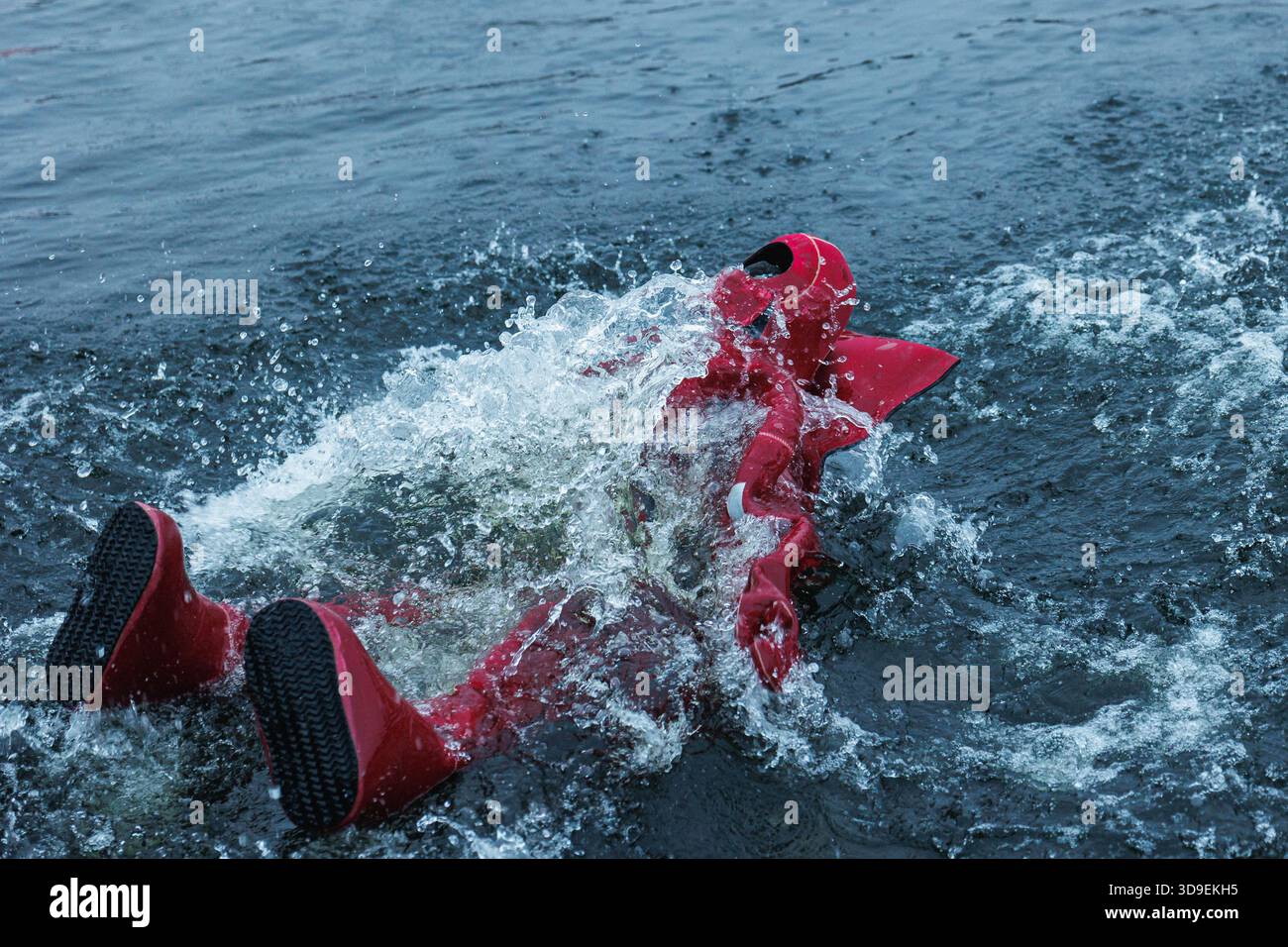 Red Immersion Suit Floating In Turbulent Water, Person Supine, Choppy ...