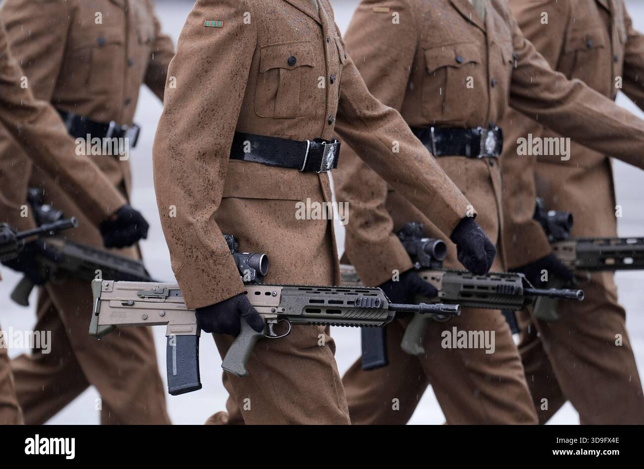 Members of the 5th Battalion, The Rifles (5 Rifles) carry their rifles ...