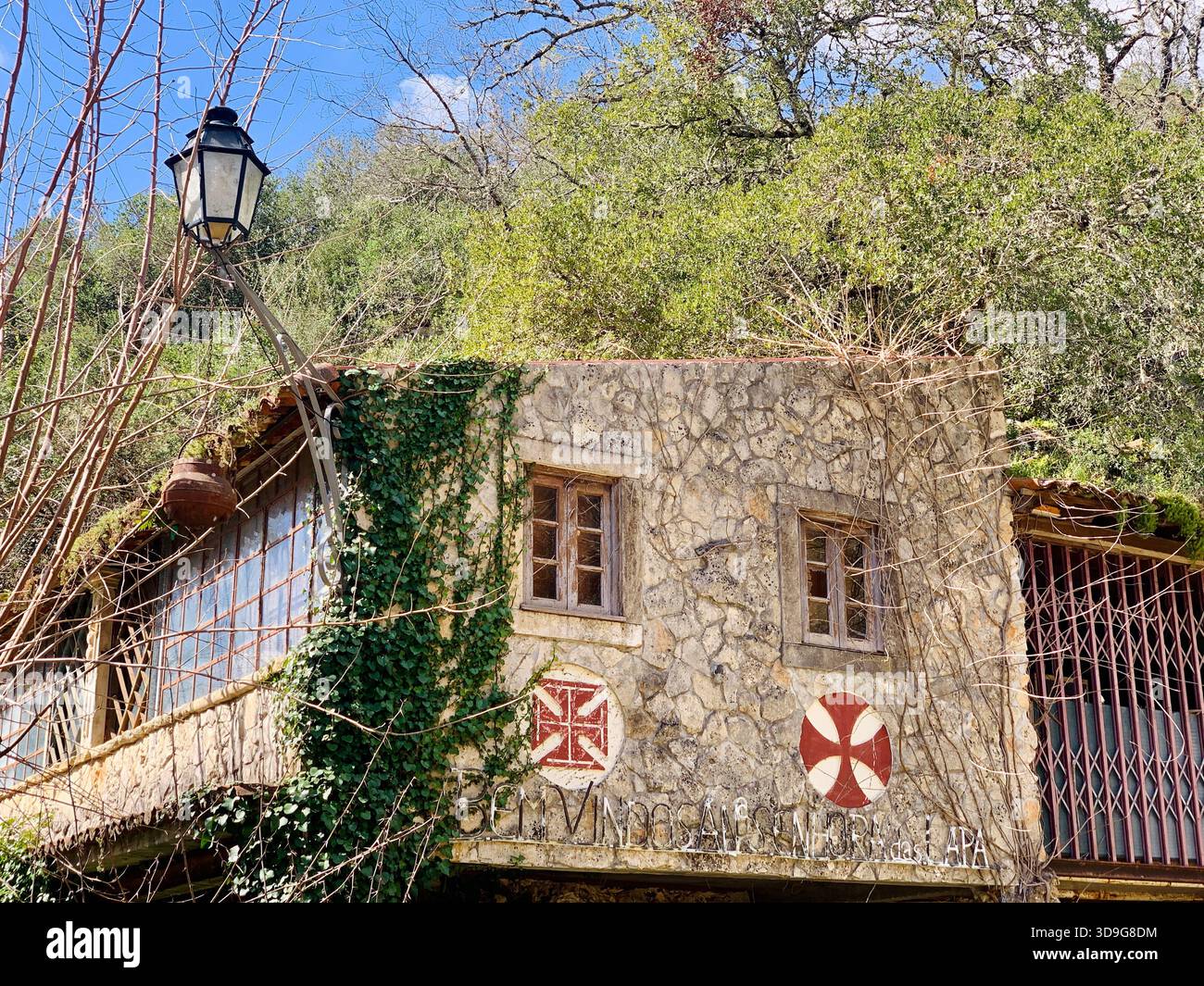 Overgrown, abandoned building decorated with Templar crosses - Smartphone Captured Stock Image
