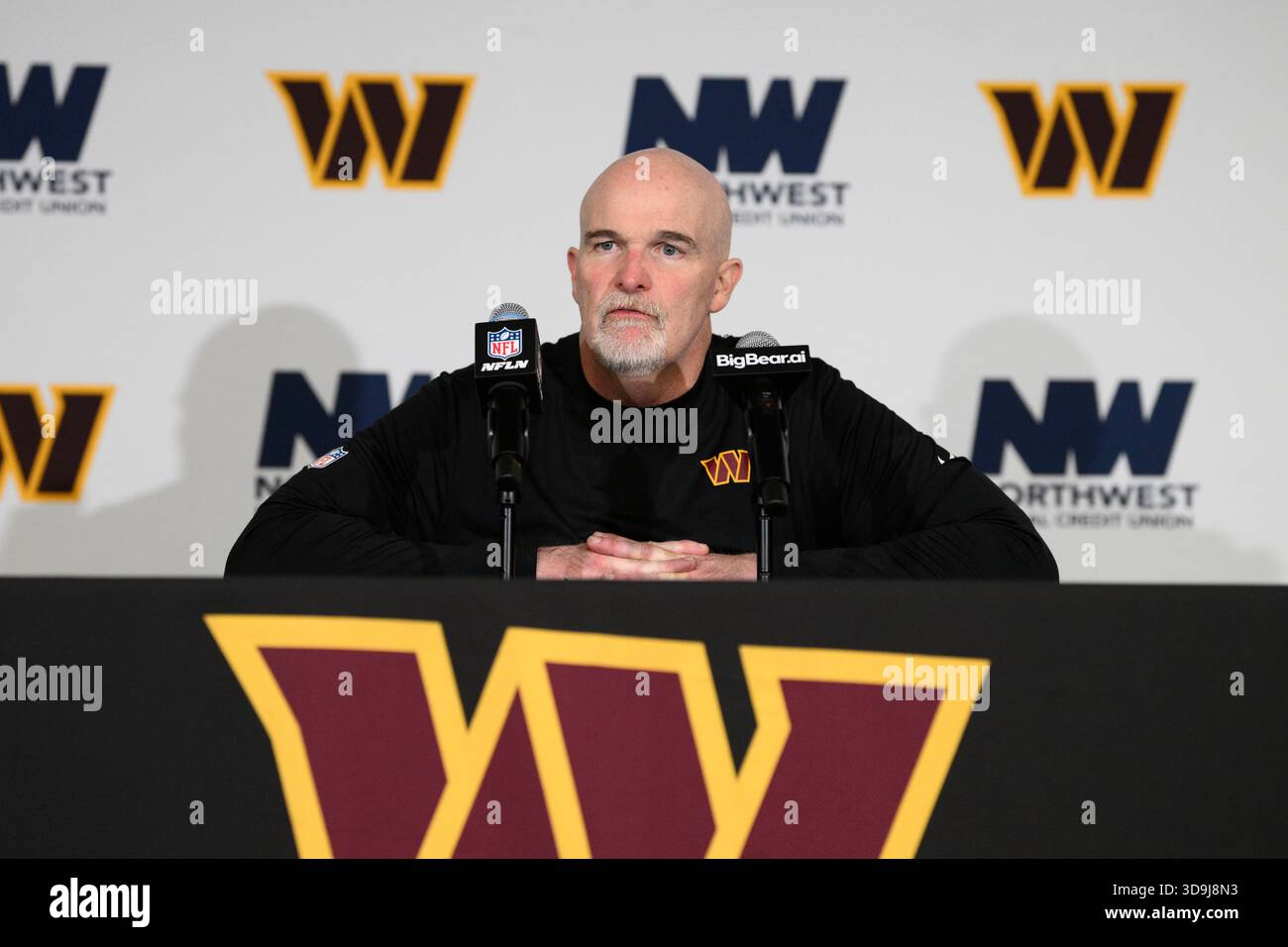 Washington Commanders head coach Dan Quinn speaks during a news ...