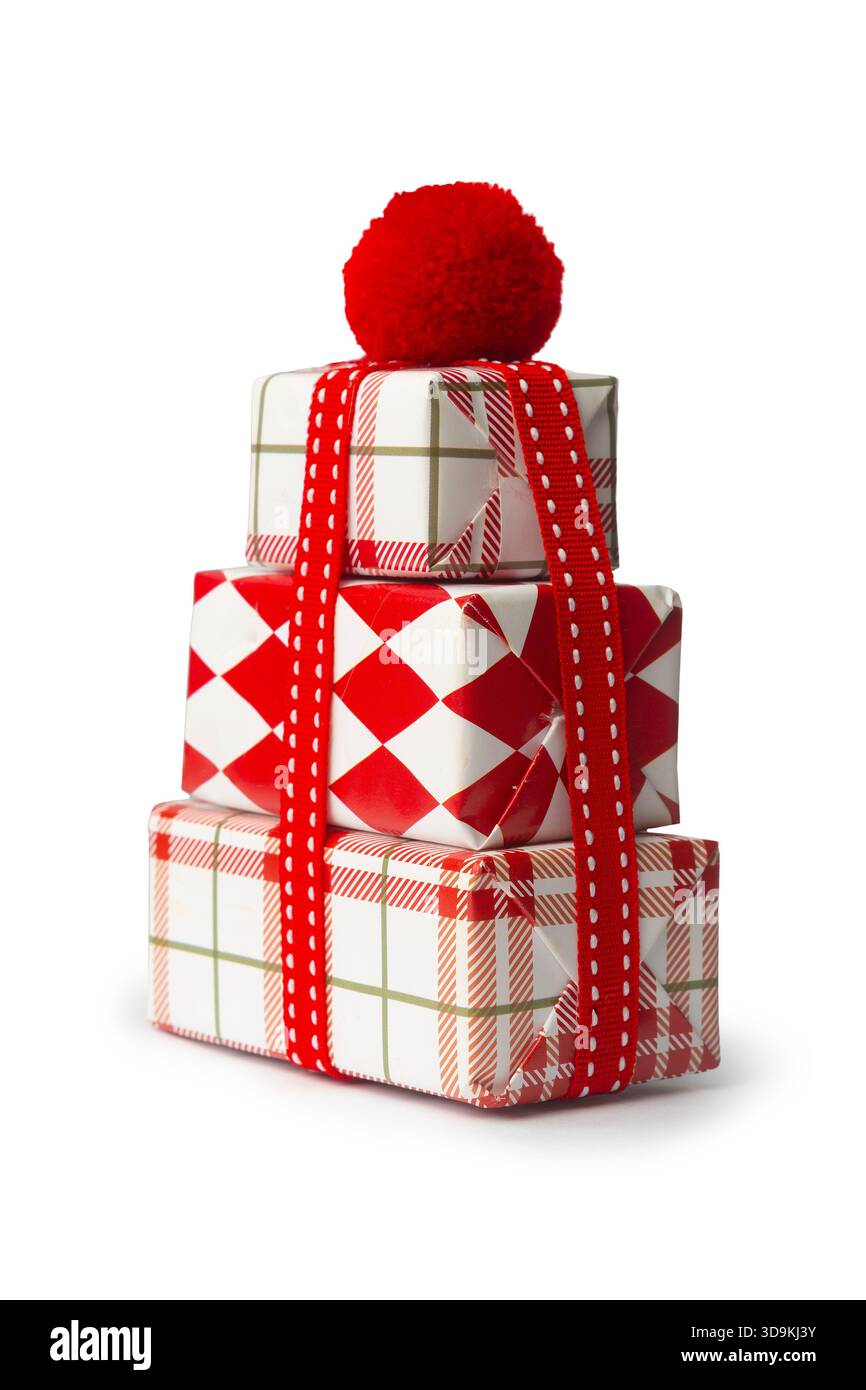 Stacked christmas gift boxes with red bow on white background Stock Photo