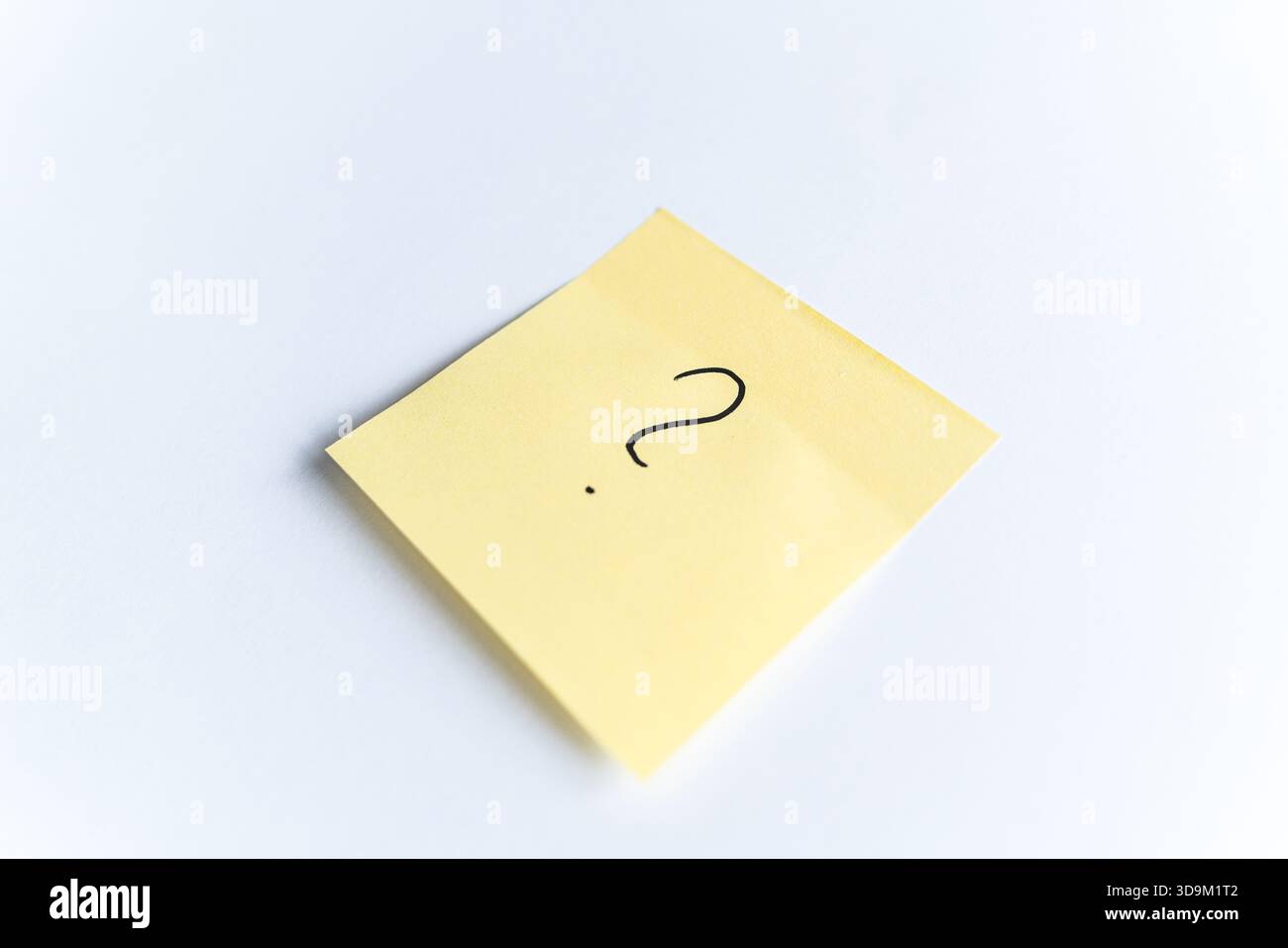 Yellow sticky note with question mark Stock Photo