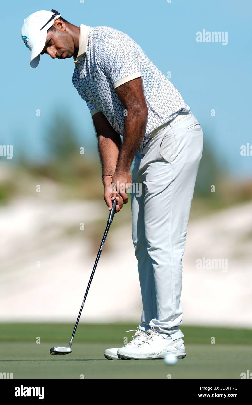 Aaron Rai, of England, watches his putt on the fourth green during the ...