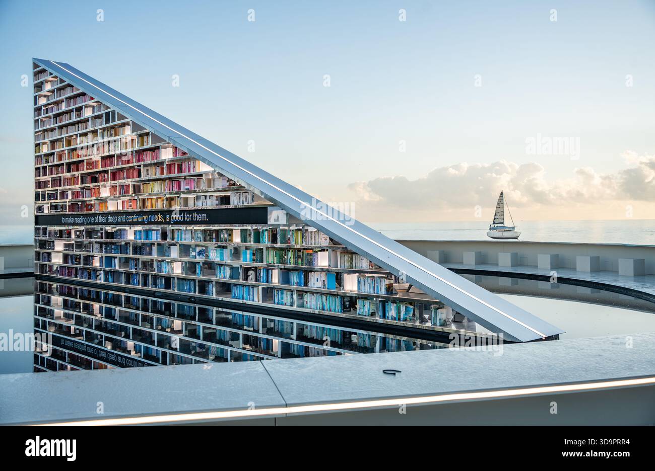 Rotating Triangular Exhibit December 6, 2025: Art Basel in Miami: Library of US is a 50 foot ...