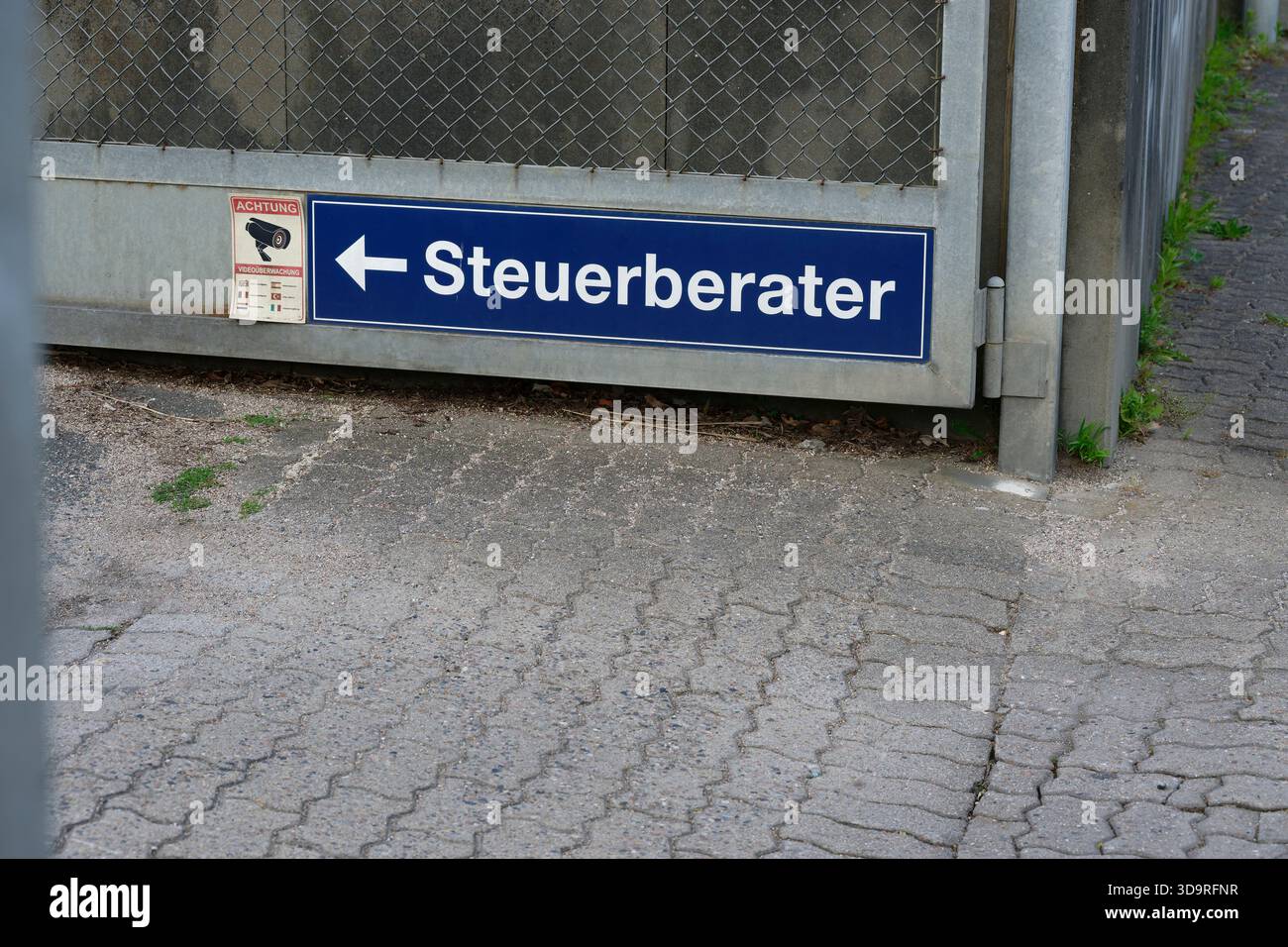 Sign In German A sign in German for a tax consultant's office with a directional arrow ...