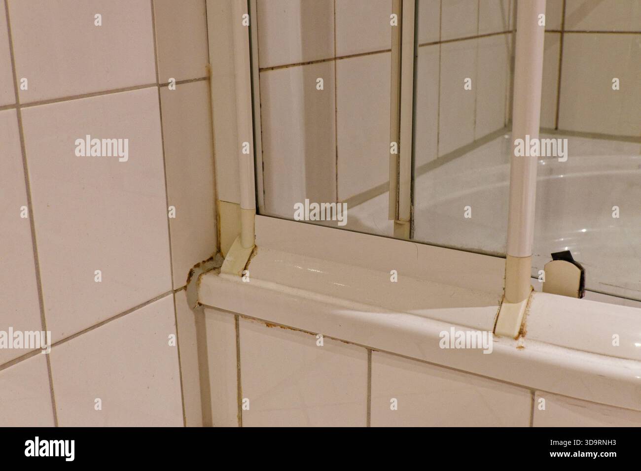 Window Frame Grout Ing A tiled bathroom wall features a small interior window a meter above ...