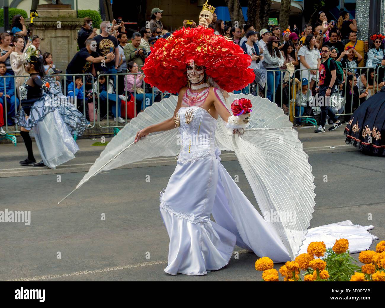 Woman in Day of the Dead costume and face paint parades in Mexico City, Mexico Stock Photo