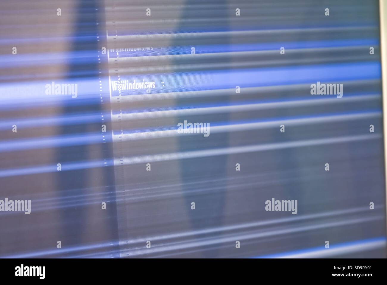 An abstract representation of a computer screen displaying distorted lines and text, creating a dynamic visual effect. Stock Photo