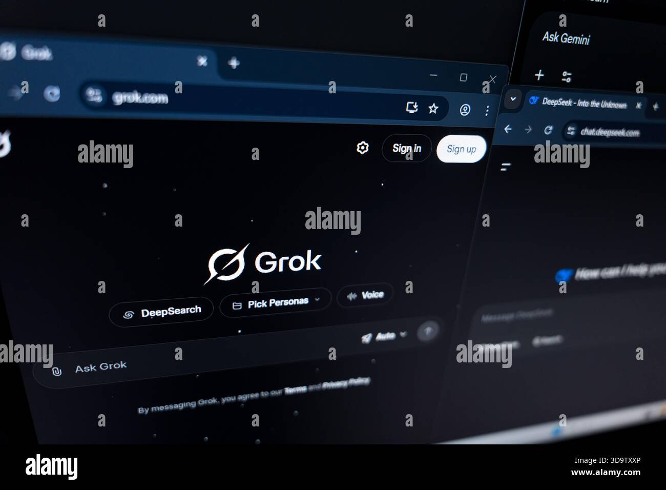 Grok AI website interfaces on computer screen Stock Photo
