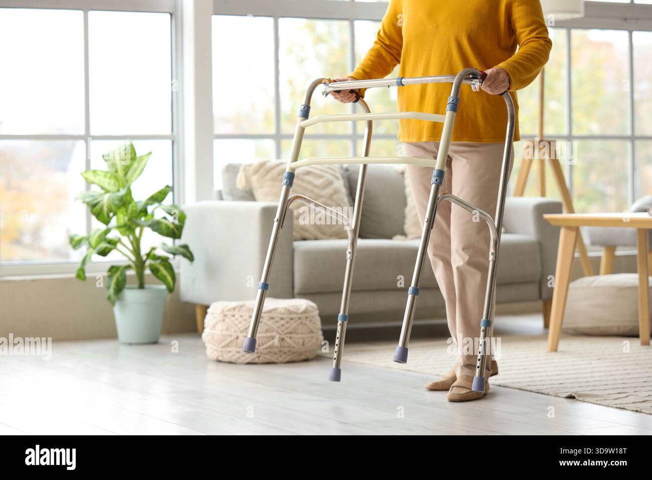 Mature woman using walker hi-res stock photography and images - Alamy