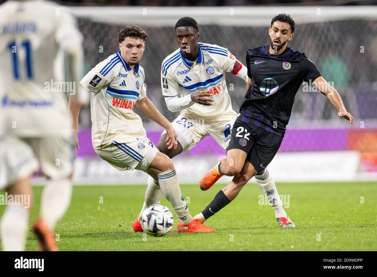 Rafik Messali of Toulouse Football Club and Mamadou Sarr of Strasbourg ...