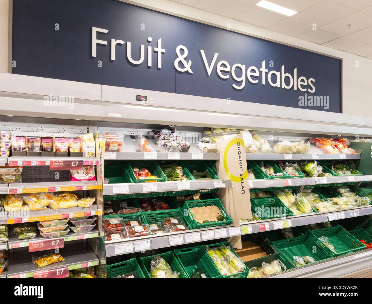 Fresh fruit and vegetables for sale at Waitrose supermarket, Basingstoke. Concept: cost of living, healthy food, plastic packaging, forever chemicals - Smartphone Captured Stock Image