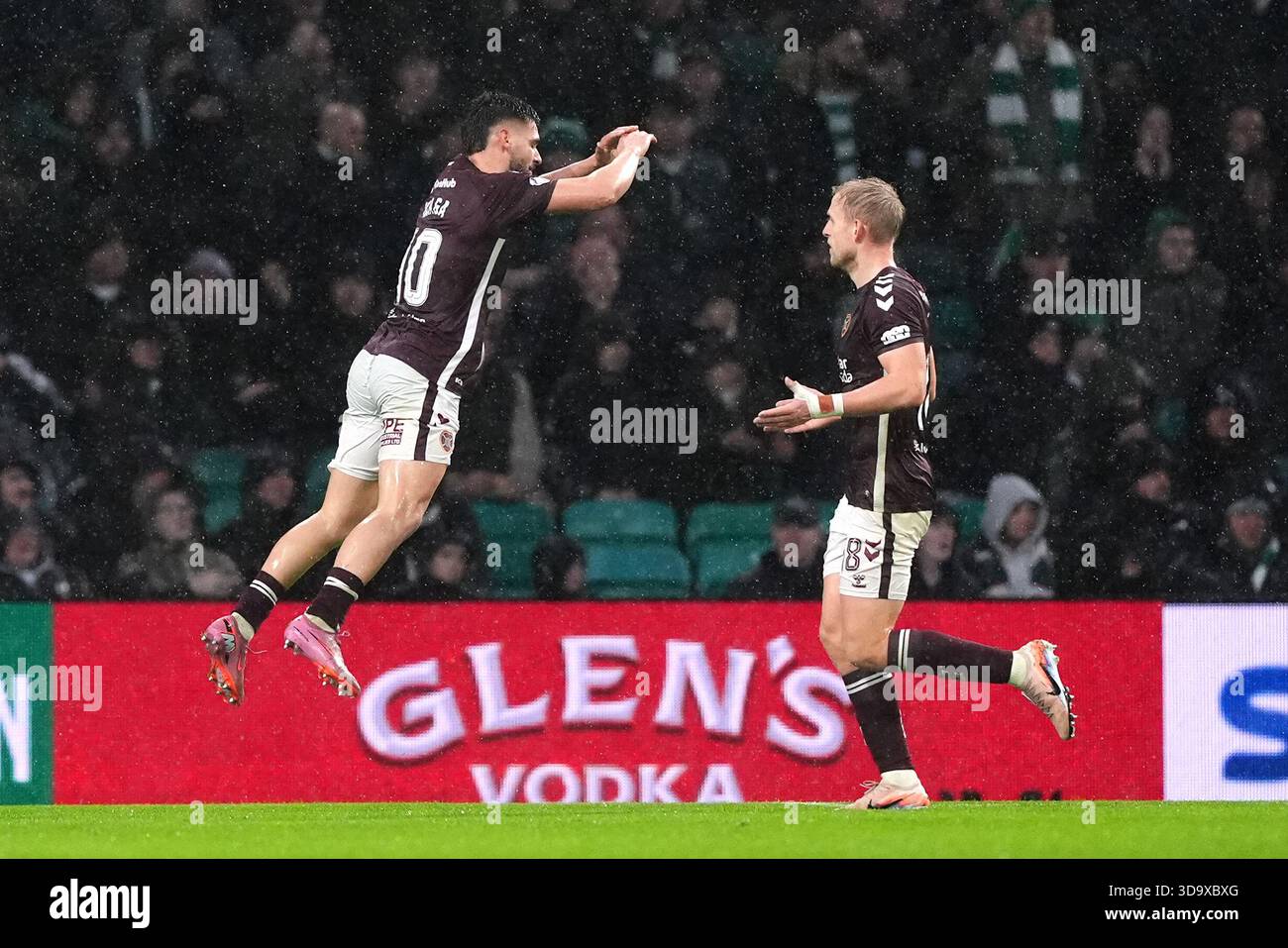 Heart Of Midlothian S Claudio Braga Left Celebrates Scoring Their
