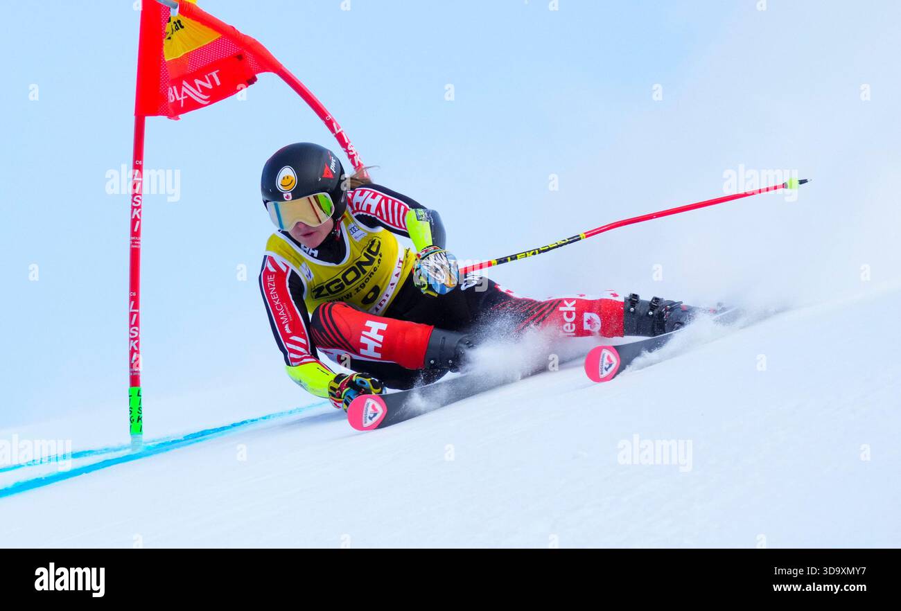 Valerie Grenier, of Canada, speeds down the course as she races in the ...