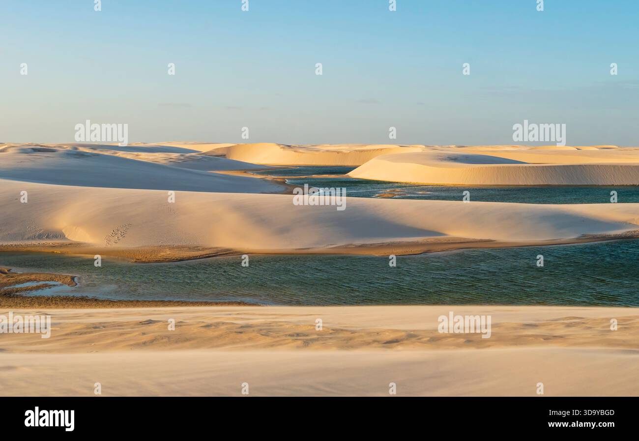 Scenic view of crystal clear blue lagoons surrounded by white sand