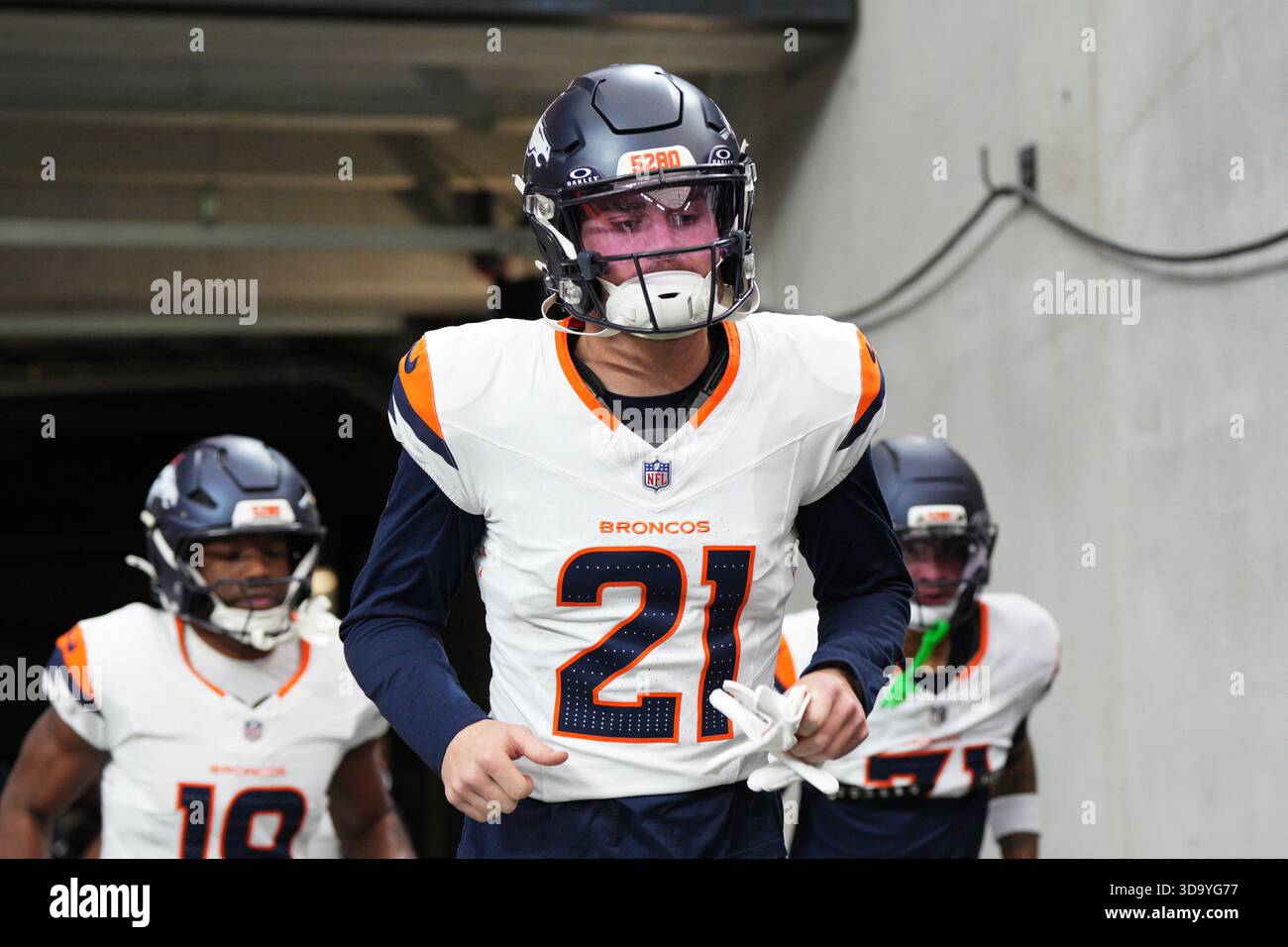 Denver Broncos cornerback Riley Moss (21) jogs onto the field before an ...