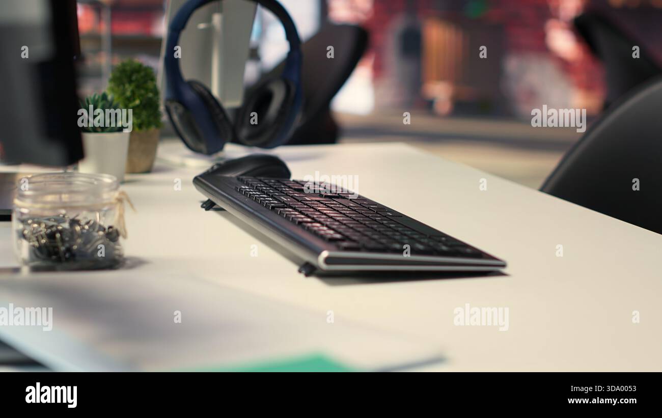 Office desktop setup includes monitors displaying terminal interfaces and AI systems. The self learning model showcases deep learning innovations and modern computing technologies. Stock Photo