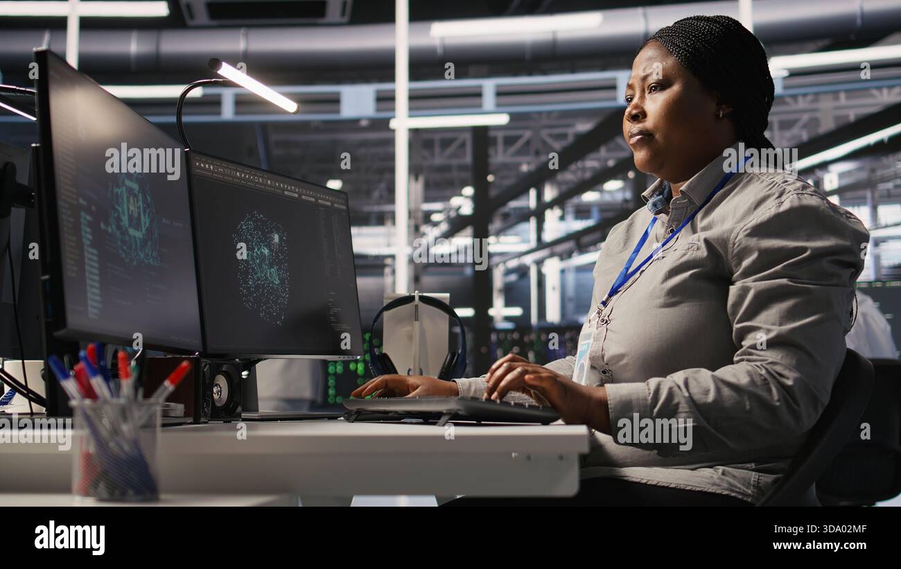 Data center computer scientist using PC to monitor artificial ...