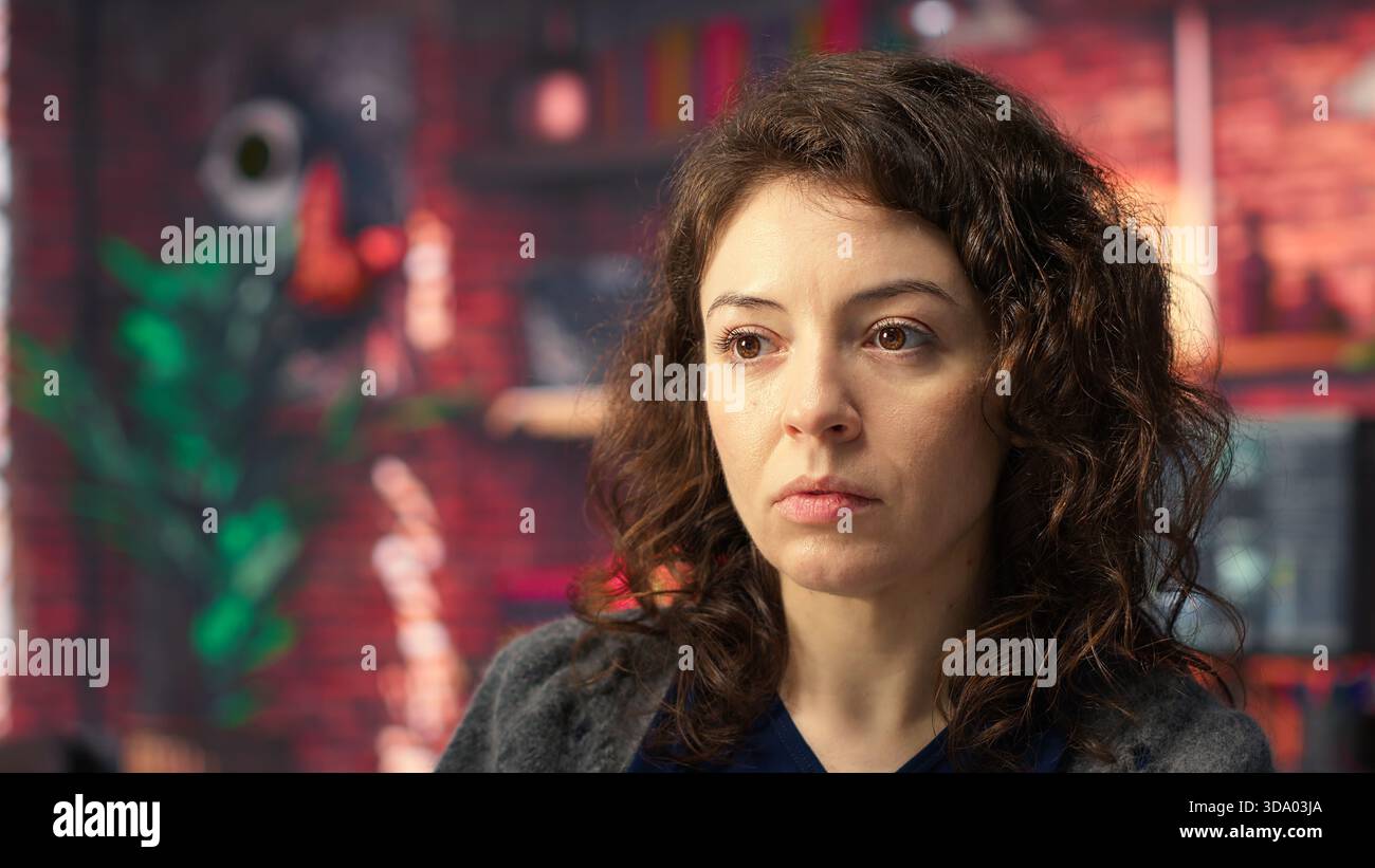 Software expert at workstation programming on pc and writing lines of code, using coding tools and a terminal window interface. Woman debugging software for web development. Camera B. Stock Photo