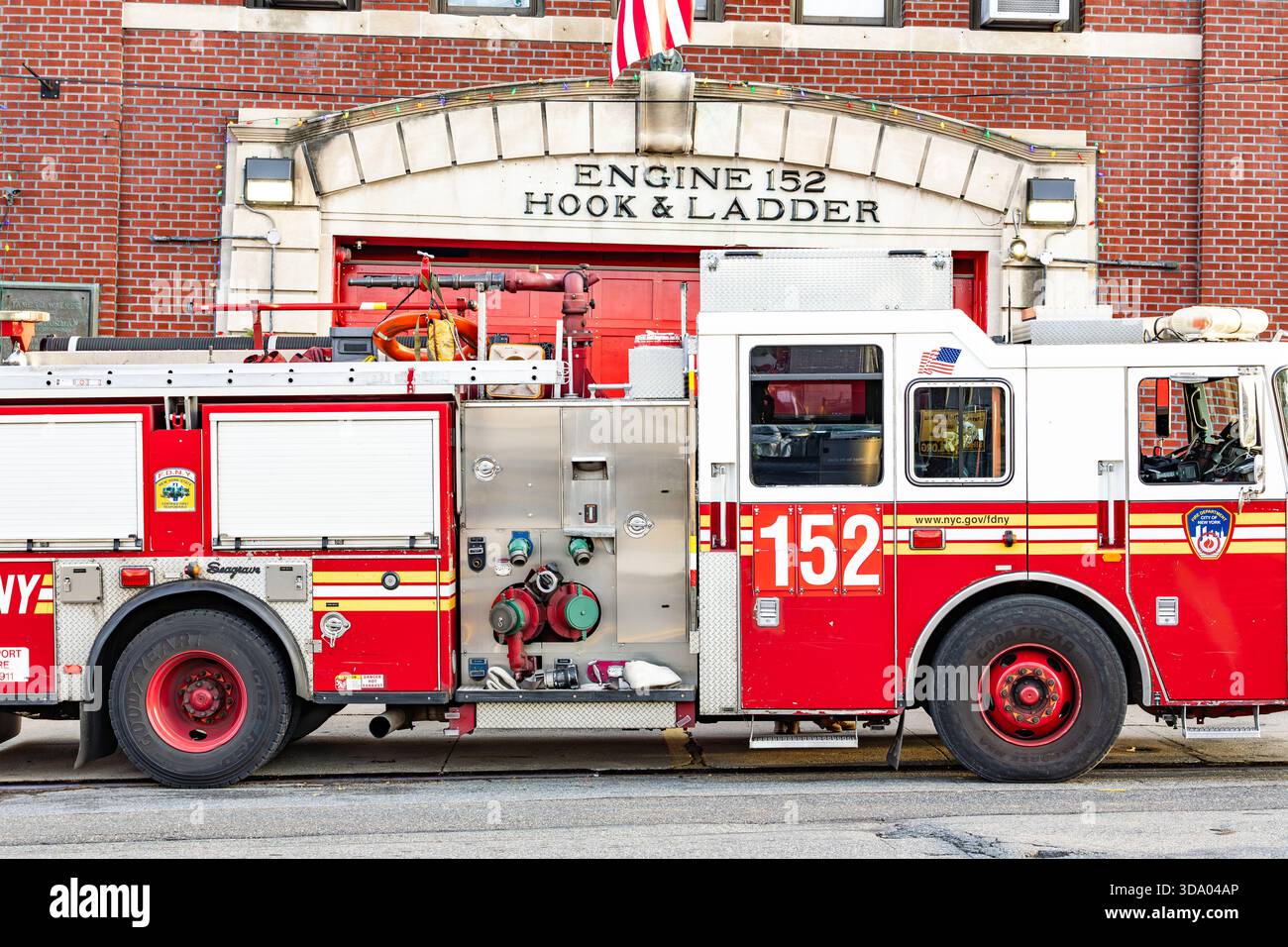 Fdny engine 152 firehouse exterior with fire trucks parked in front ...