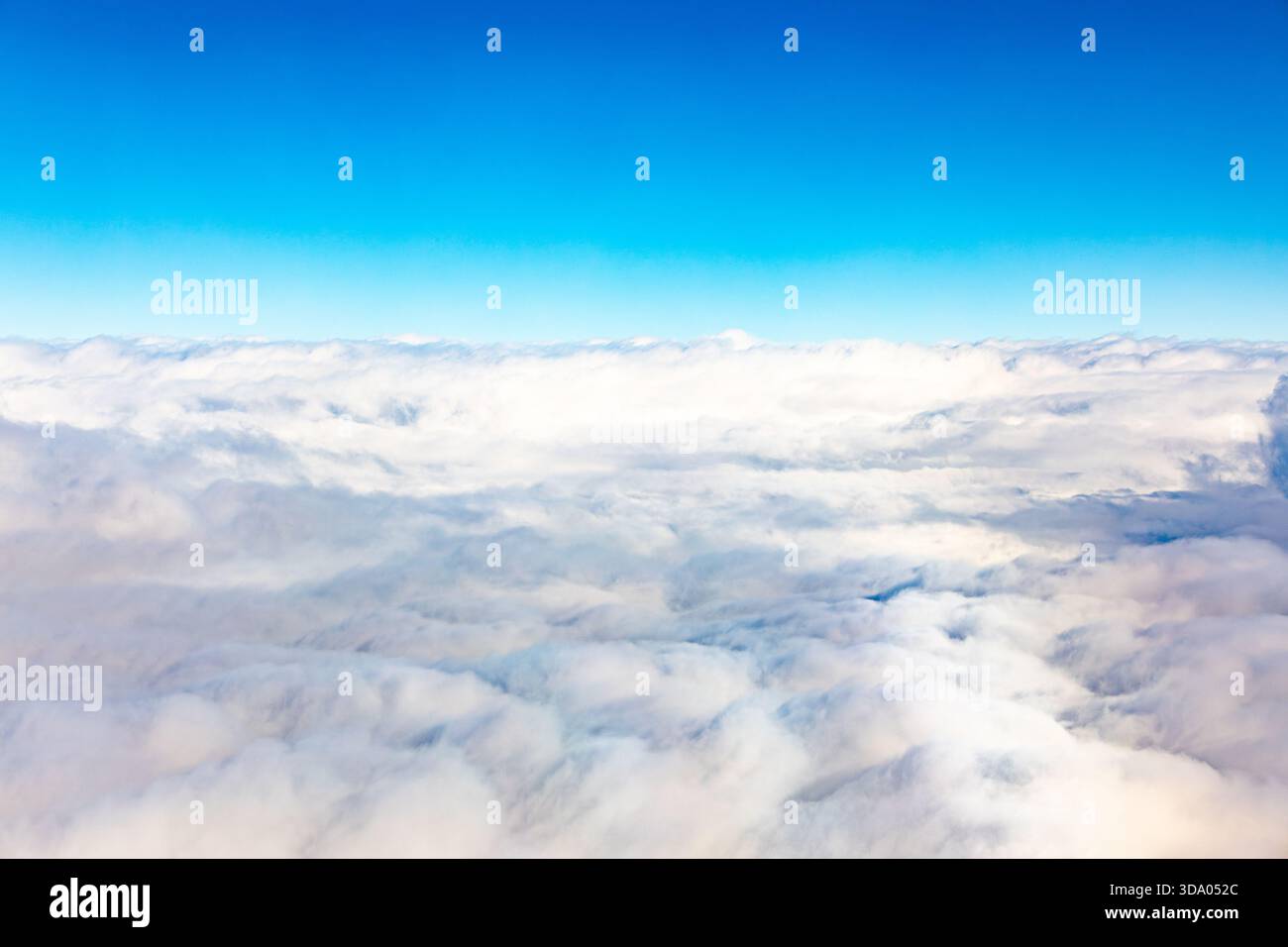 Aerial view of dense fluffy white clouds under a clear blue sky Stock ...