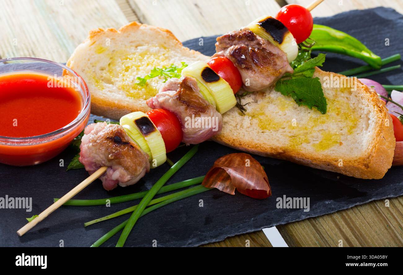 Mutton slices on barbecue skewers Stock Photo
