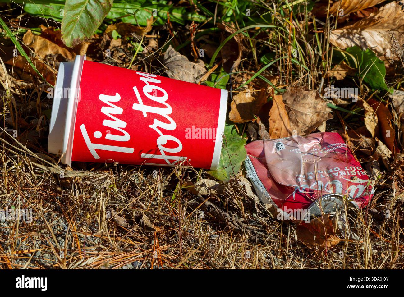 Empty beverage cup on the ground Stock Photo