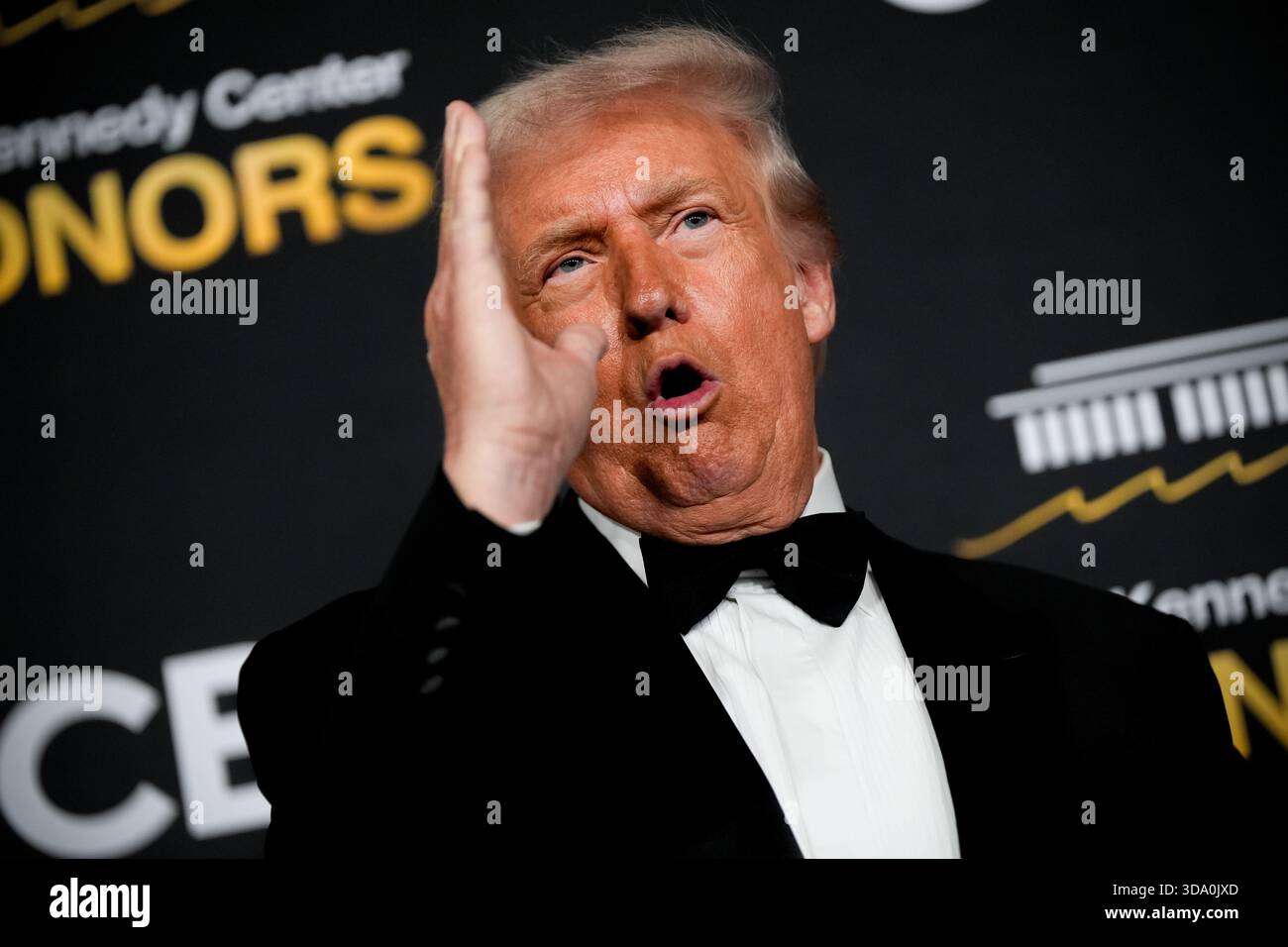 President Donald Trump speaks on the red carpet before the 48th Kennedy ...