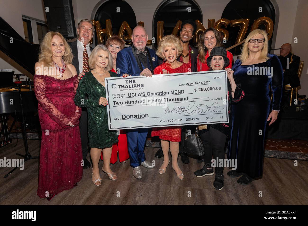 Los Angeles, USA. 06th Dec, 2025. President Frank Sheftel, Honoree Madeline  Gussman, Chair Ruta Lee and Thalians Board present $250K check to UCLA  Operation Mend at the 70th Anniversary Thalians Holiday Gala