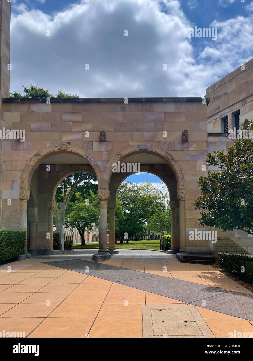 Sandstone arches at the University of Queensland, St Lucia campus, Brisbane Historic Great Court architecture on a sunny day - Smartphone Captured Stock Image